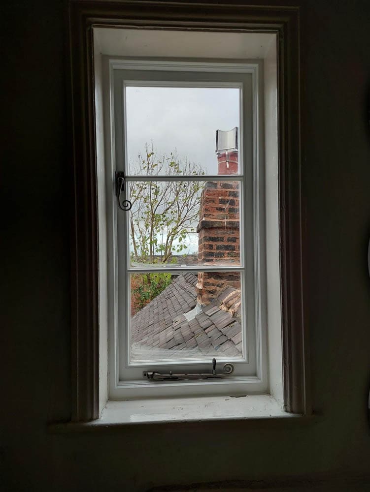 Interal view of a single heritage casement window with vacuum insulated glass