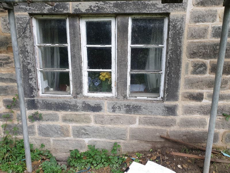 The original timber casement windows before replacement