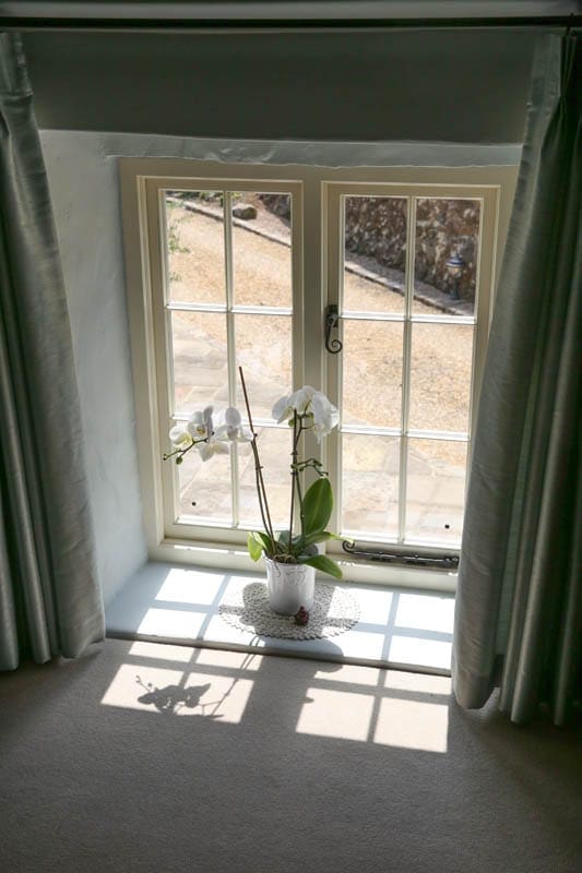 Heritage casement window with Georgian window bars seen from inside Quarry Cottage in Belper