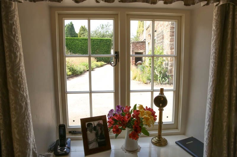 Heritage window with Georgian bars seen from inside Quarry Cottage in Derbyshire