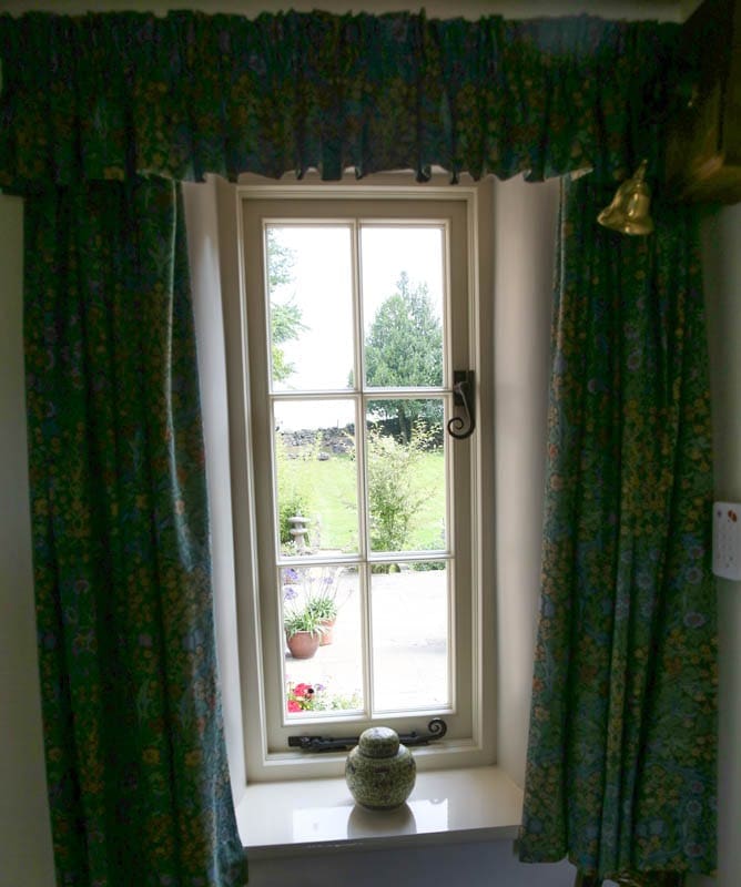 Single casement heritage window seen from inside Quarry Cottage, Belper