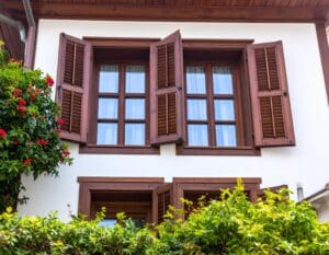 Replacement windows for historic homes in Turkey featuring intricately carved wooden frames and vacuum glazing in a restored traditional Ottoman-style building