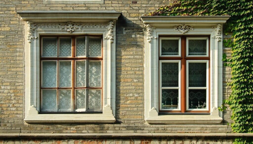 The image depicts a beautifully preserved historic building in Czechia renovated with landvac vacuum glazing in the windows