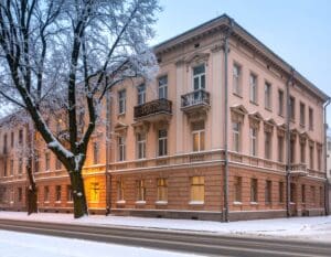 Glazing for Renovation be - A side-by-side visual of an old Belarusian apartment building during winter